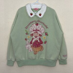 Dolls Kill Strawberry Shortcake Sweatshirt with lace & embroidery details.